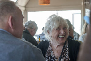 Shared moments: A guest enjoying good conversation and camaraderie during the meetup.