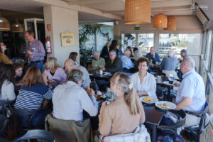 Building community: International residents sharing stories and connections over lunch.