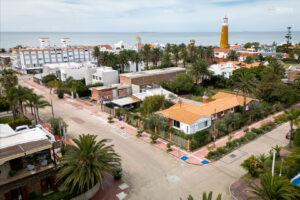 Playa Brava: A residential street in Playa Brava, where houses and apartment buildings share the block, a short walk from the beach.